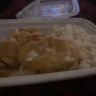 chicken and rice in a styrofoam container