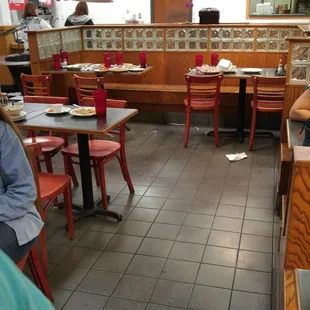 All those tables (every table in the restaurant) were empty of people, but setting with tons of food getting crusty and gross.