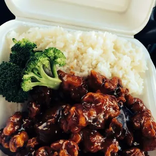 broccoli and rice in a styrofoam container