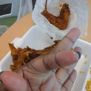 Greasy fingers from burnt chicken