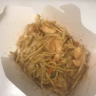 shrimp and noodles in a paper container