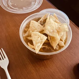 a bowl of tortilla and a fork