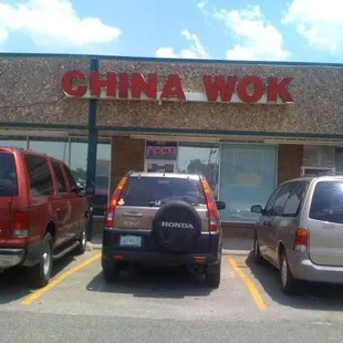 cars parked in front of a store