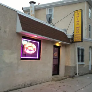 a neon sign for a chinese restaurant