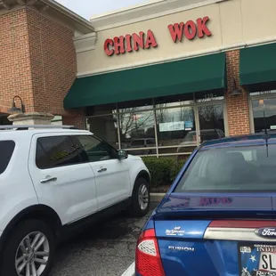 cars parked in front of a chinese restaurant
