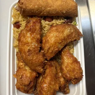 chicken wings and rice in a styrofoam container