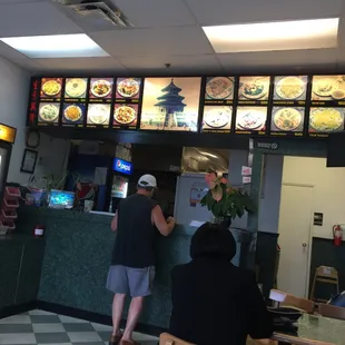 people ordering food at a restaurant