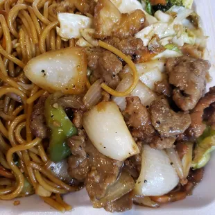 2 plate entree, noodles, pepper steak and chicken with broccoli and cabbage