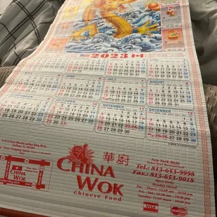 a chinese calendar on a bed
