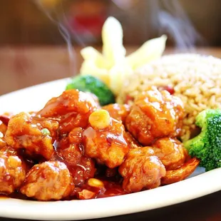 a plate of food with rice and broccoli