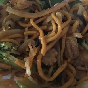 a plate of noodles and broccoli