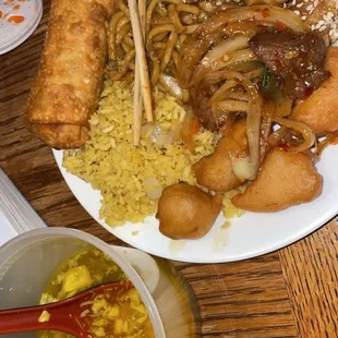 a plate of food with chopsticks