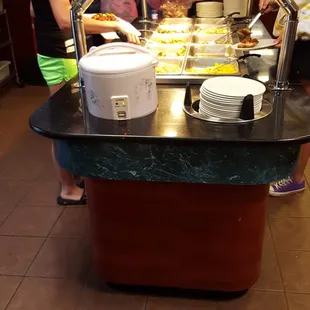 a group of people serving food