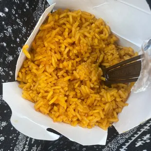 a bowl of rice and a fork