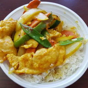 a plate of food with rice and vegetables
