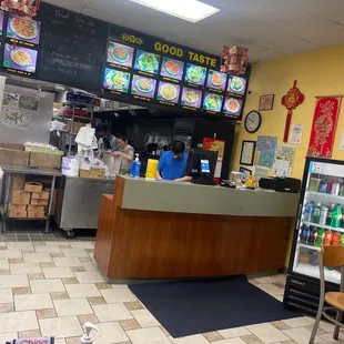 a restaurant counter with food on the counter