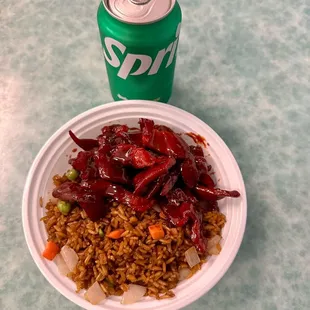 a can of soda and a plate of food