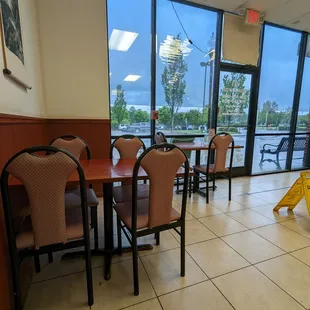 a restaurant with tables and chairs