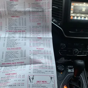 a car dashboard with a menu in the center
