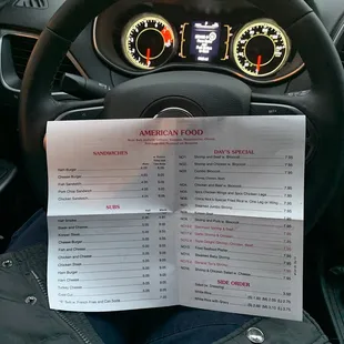 a driver&apos;s dashboard with a car&apos;s steering wheel