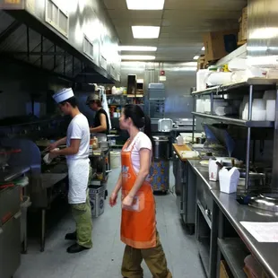 a man and a woman in a kitchen