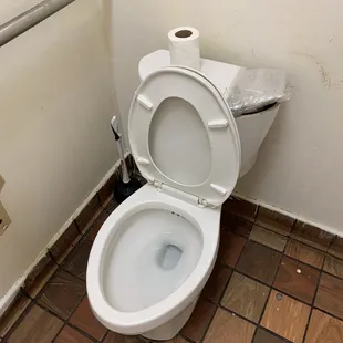 a toilet in a public restroom
