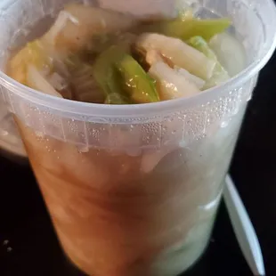 a plastic bowl of soup