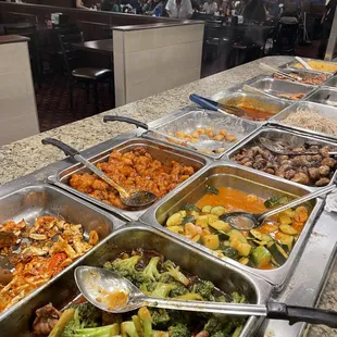 a variety of food in a buffet