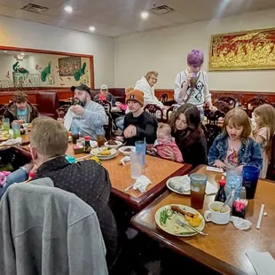 a group of people sitting at a table