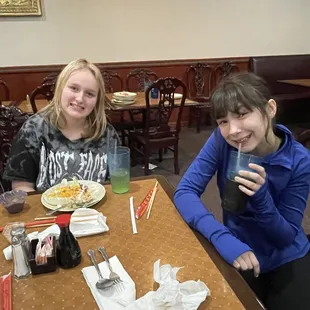 two women sitting at a restaurant table