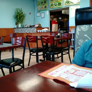 Counter from small eating area. There are 2 tables, 2 booths.