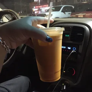 Thai tea with China town express background.