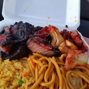 a plate of noodles and meat