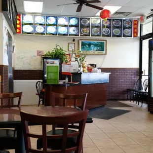 Order counter and picture menu on wall