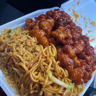a plate of noodles and meat