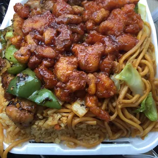 Packed with Rice chow mein orange chicken and soy sauce chicken!