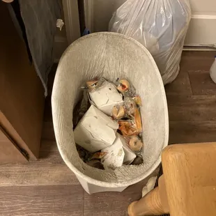 a trash can and trash bags