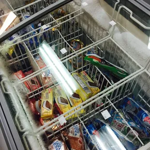 a fridge full of sodas and snacks