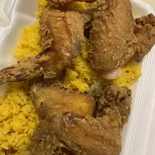 chicken and rice in a styrofoam container