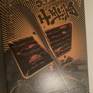 a box of chocolate cake with a knife in it