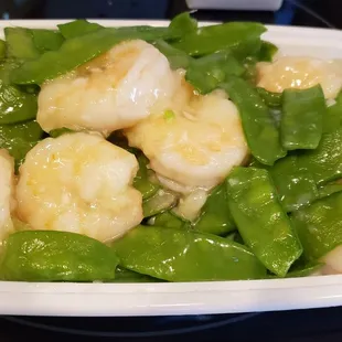 Shrimp with snow peas. White rice on side. The shrimp are very big. Takeout. Delicious!!