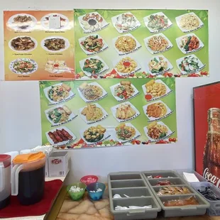 Drink and condiment station under picture menu