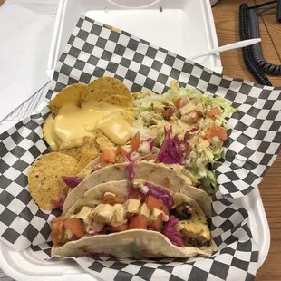 Pork tacos, salad and chips