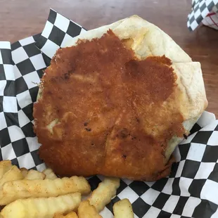 The underside of the quesadilla is sealed with crispy cheese