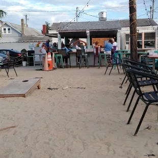 Standing near the water looking back towards bar.