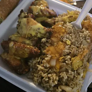 rice, meat, and vegetables in a styrofoam container