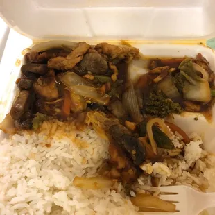 rice and vegetables in a styrofoam container