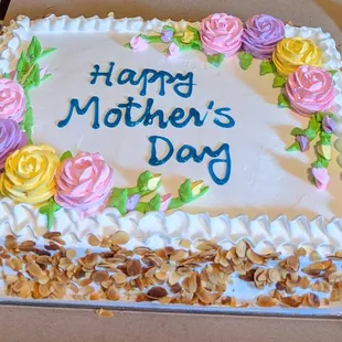 Half strawberry, half pineapple, half sheet cake w/sliced almonds on the sides.