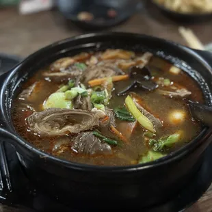 a bowl of beef and vegetable soup