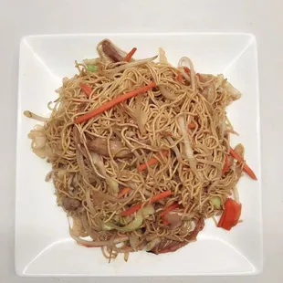 a plate of noodles and vegetables